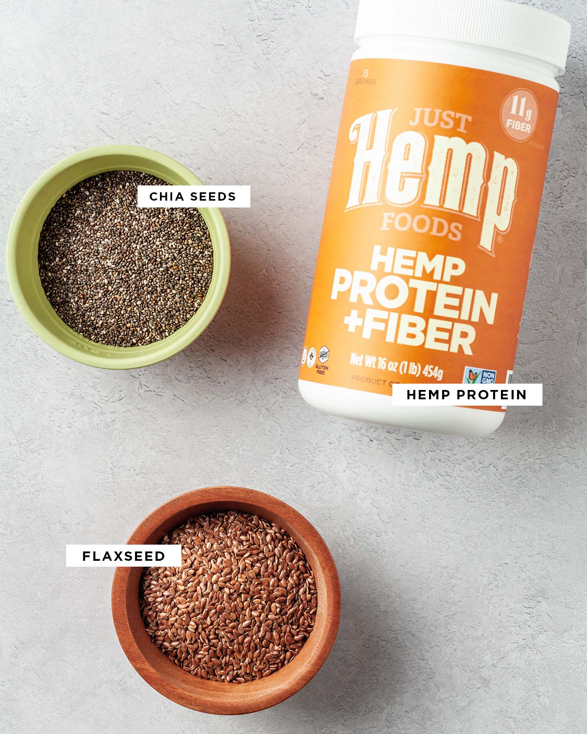 Ingredients to make homemade protein powder recipe with chia seeds, hemp protein and flaxseed.