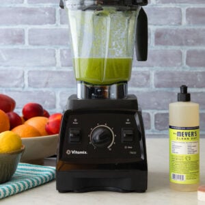 cleaning blender with dish soap and sponge