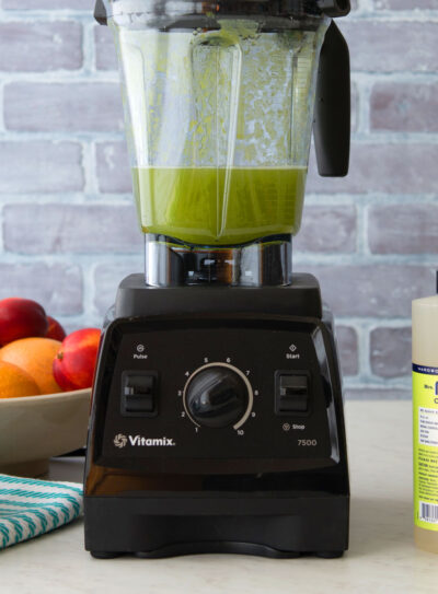 cleaning blender with dish soap and sponge