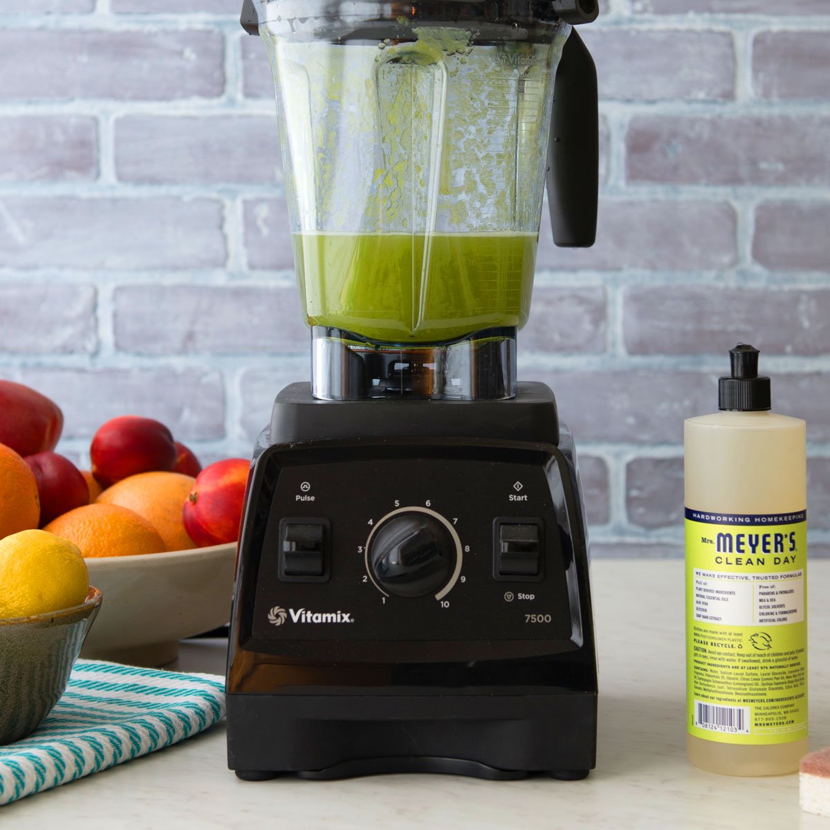 cleaning blender with dish soap and sponge