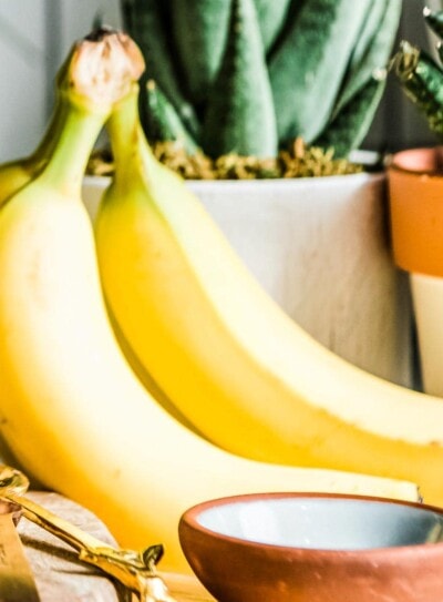 fresh group of bananas on a countertop.