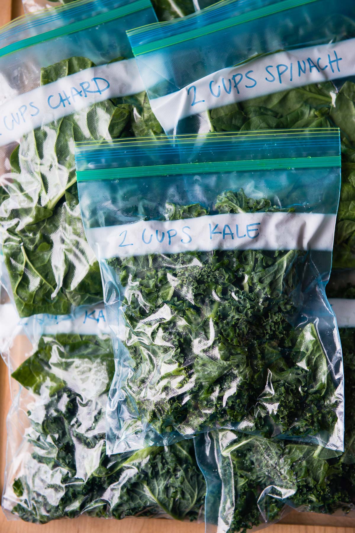 Labelled bags of fresh greens