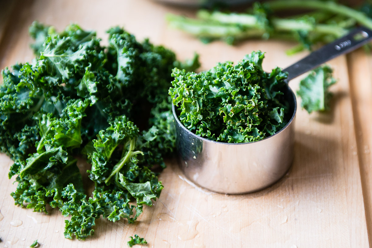 Chopped kale leaves on a cutting board