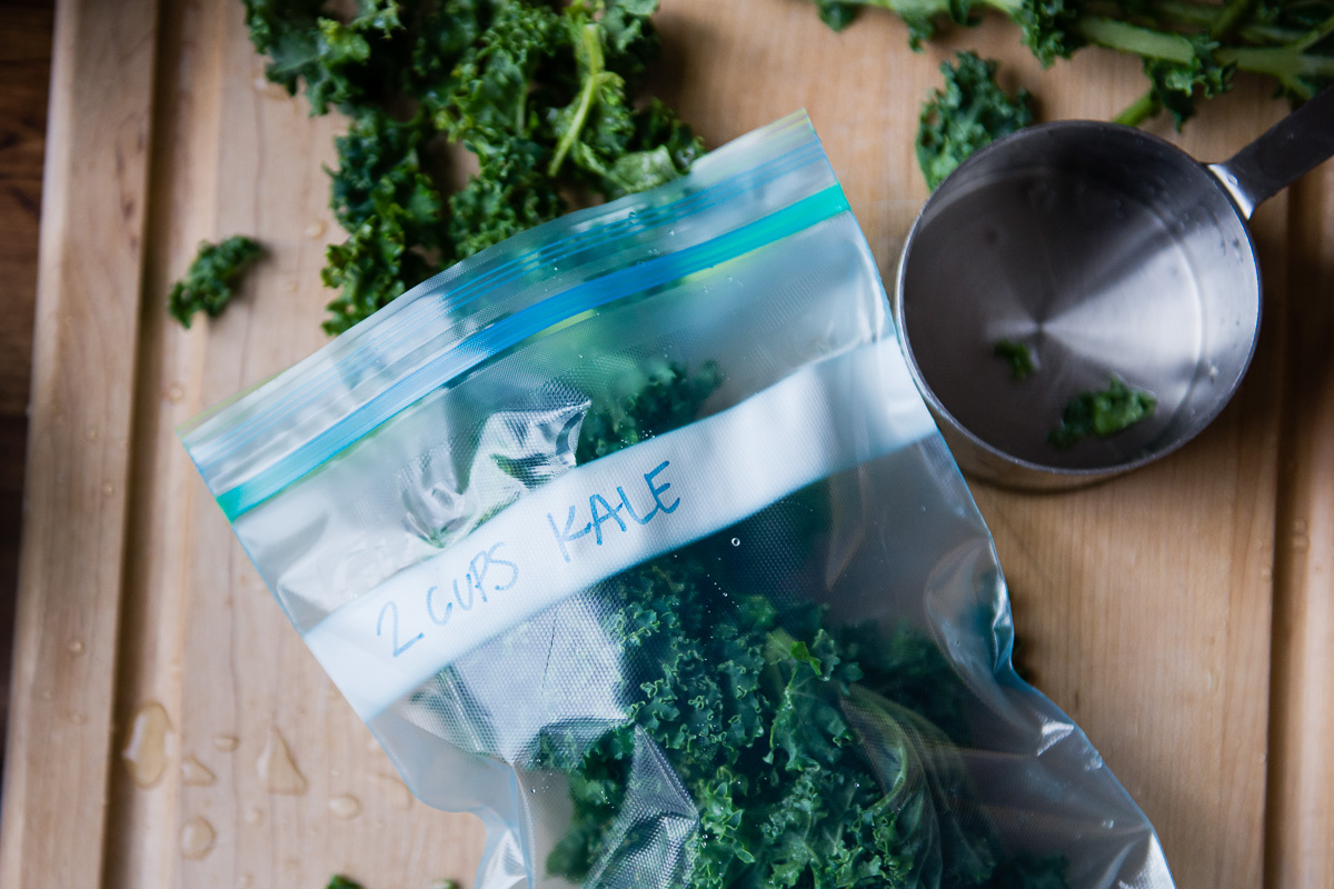 Fresh kale being stored in a press-lock plastic bag