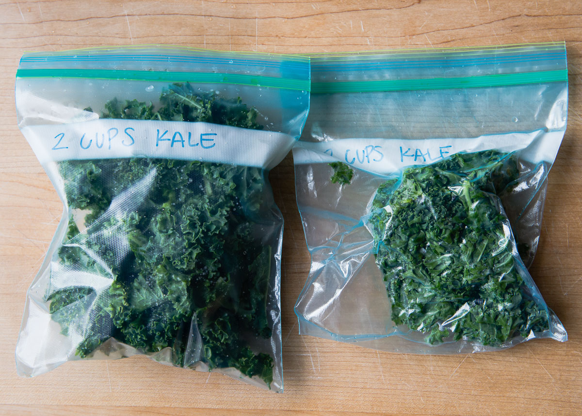 Two bags of fresh kale ready to be stored in freezer