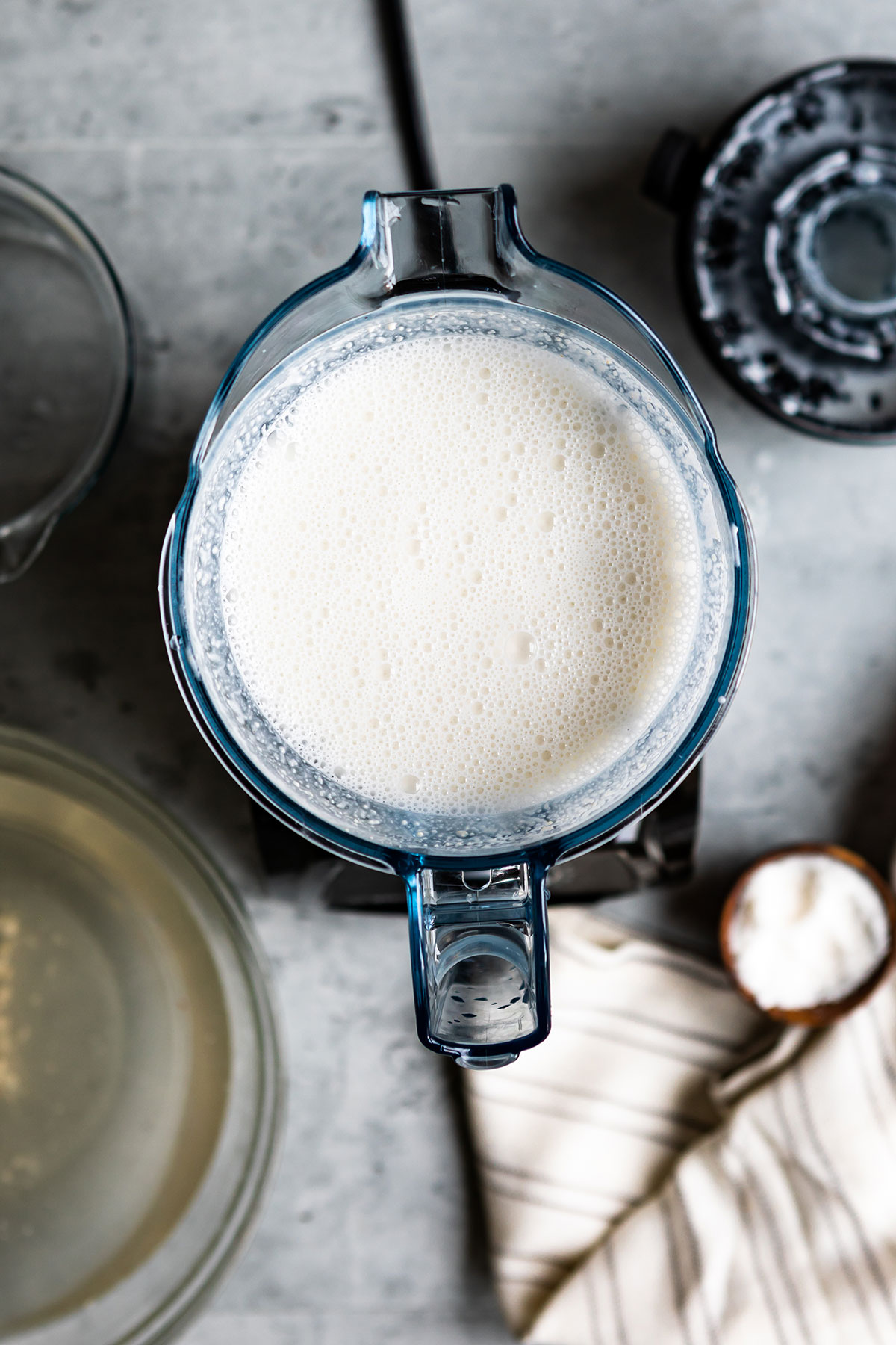 Close up view of blender with creamy cashew milk.