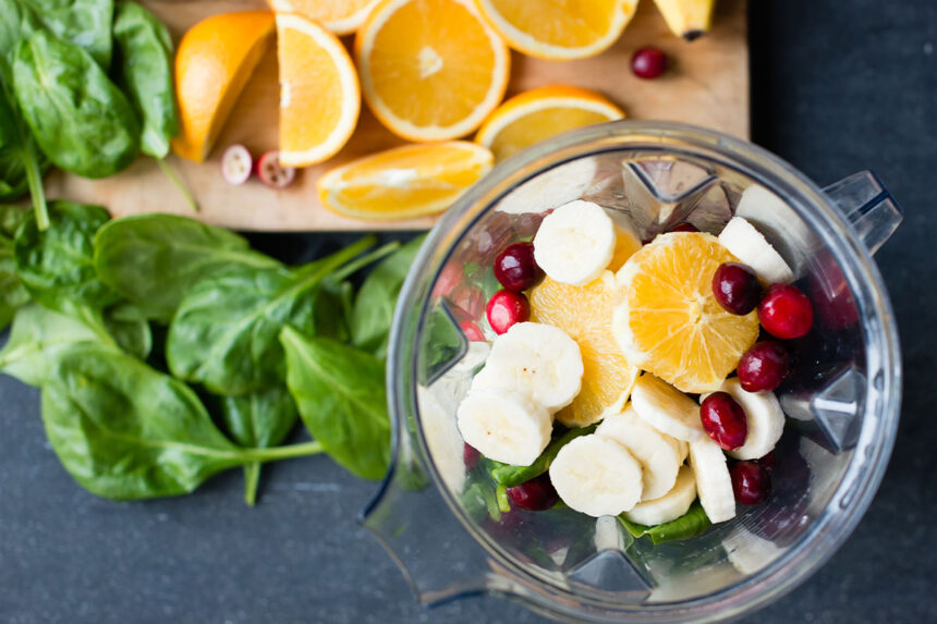 putting spinach and water in blender.