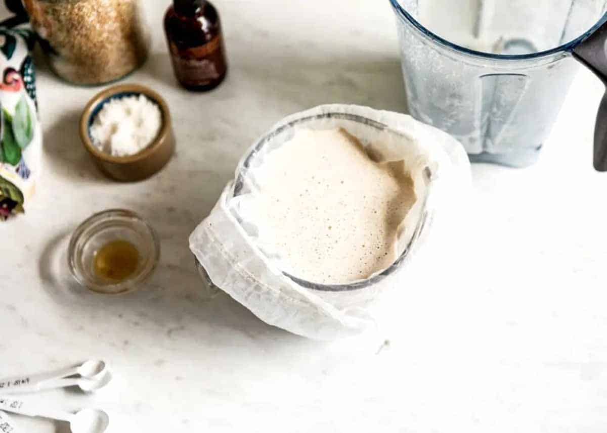 straining the pulp from the milk with a cheese cloth.