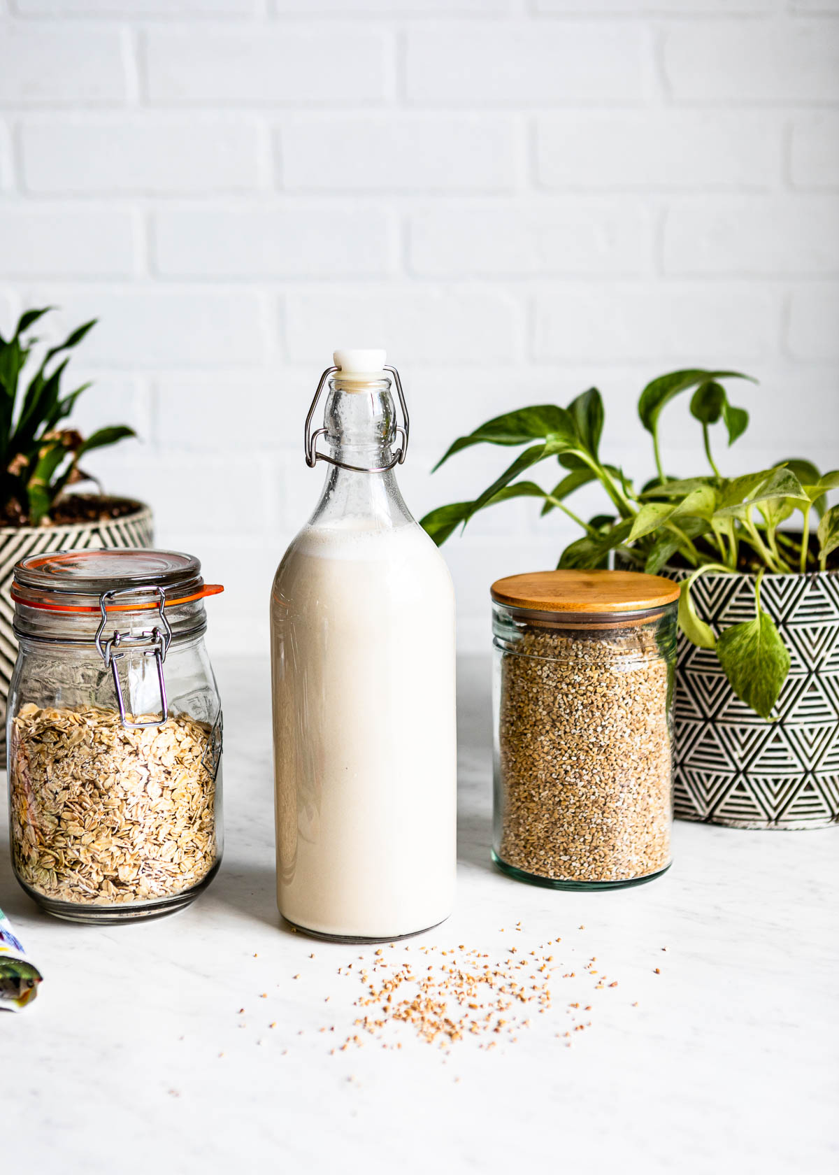 Creamy homemade oat milk recipe in a glass jar.