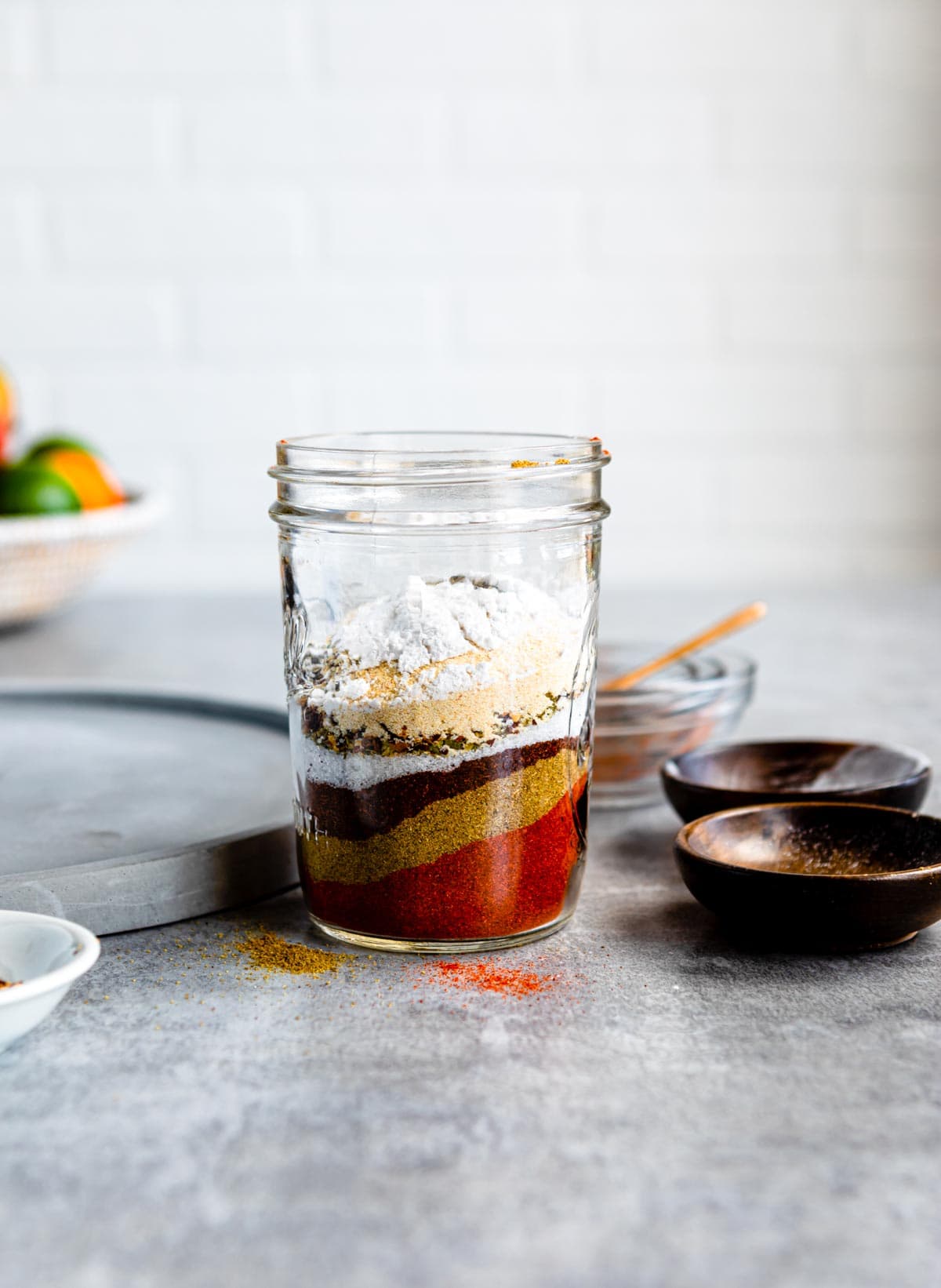 glass jar with spices for homemade taco seasoning