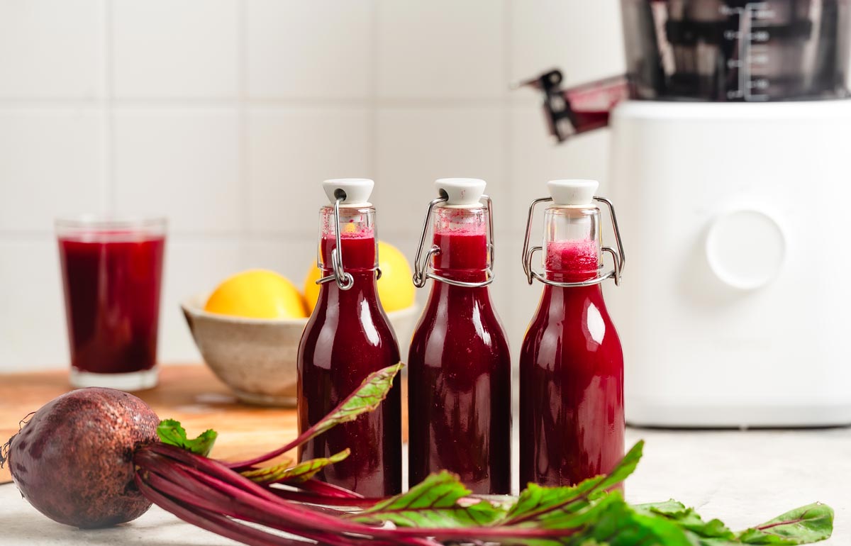 Bottles of bright red beet juice