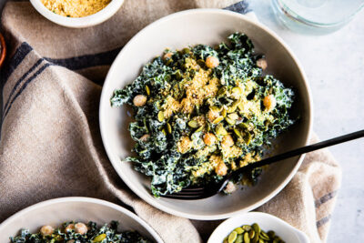 Kale caesar salad with chickpeas and vegan parmesan cheese.