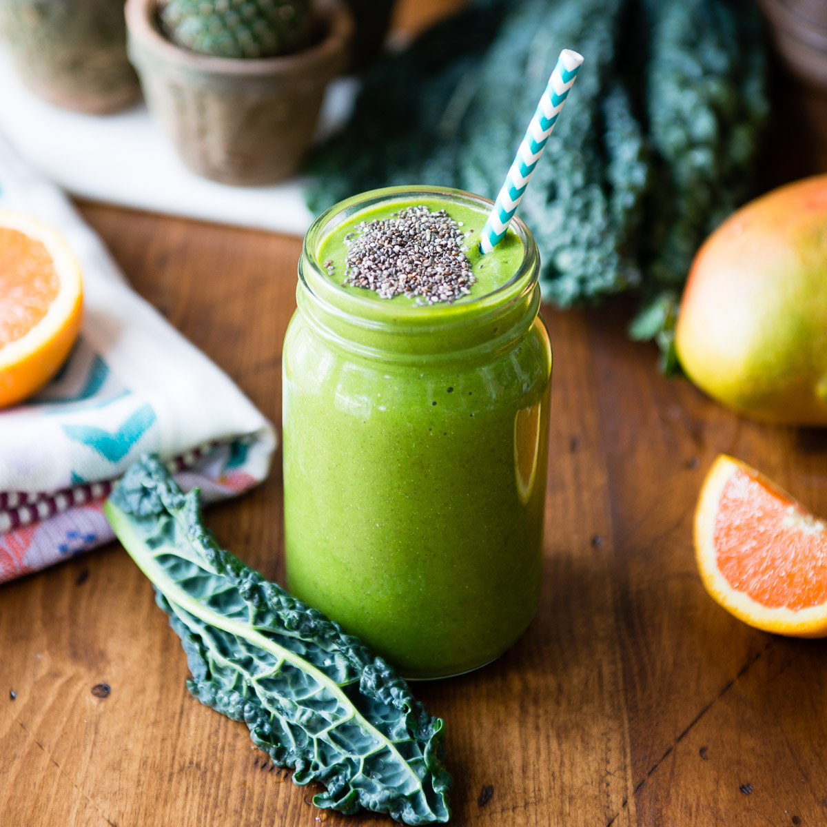 A fresh glass of kale smoothie with chia seeds on top