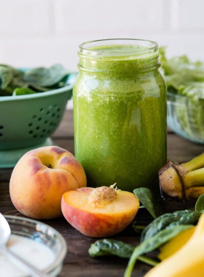 A glass of kefir smoothie surrounded by ingredients