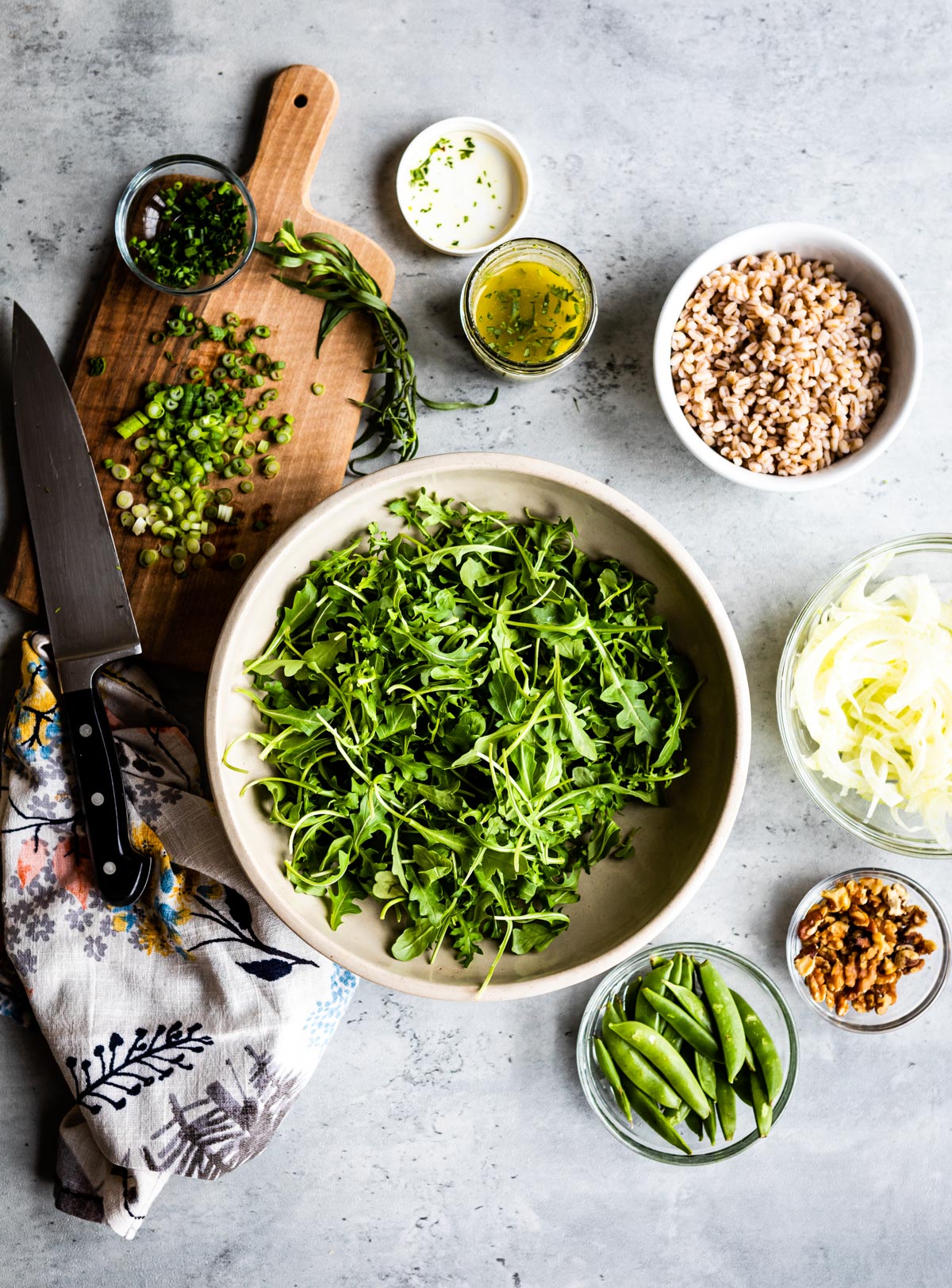 bowls of ingredients for a filling lemon arugula salad.