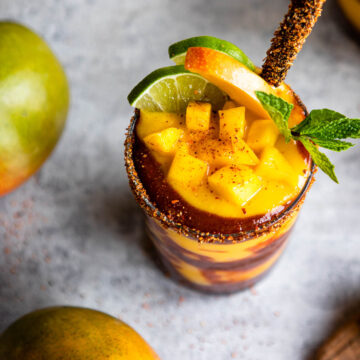 glasses of mangonada recipe with a chamoy sauce and tamarind straw