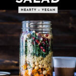 Hearty Vegan Salad in Mason Jar with woodgrain background for Pinterest - Simple Green Smoothies