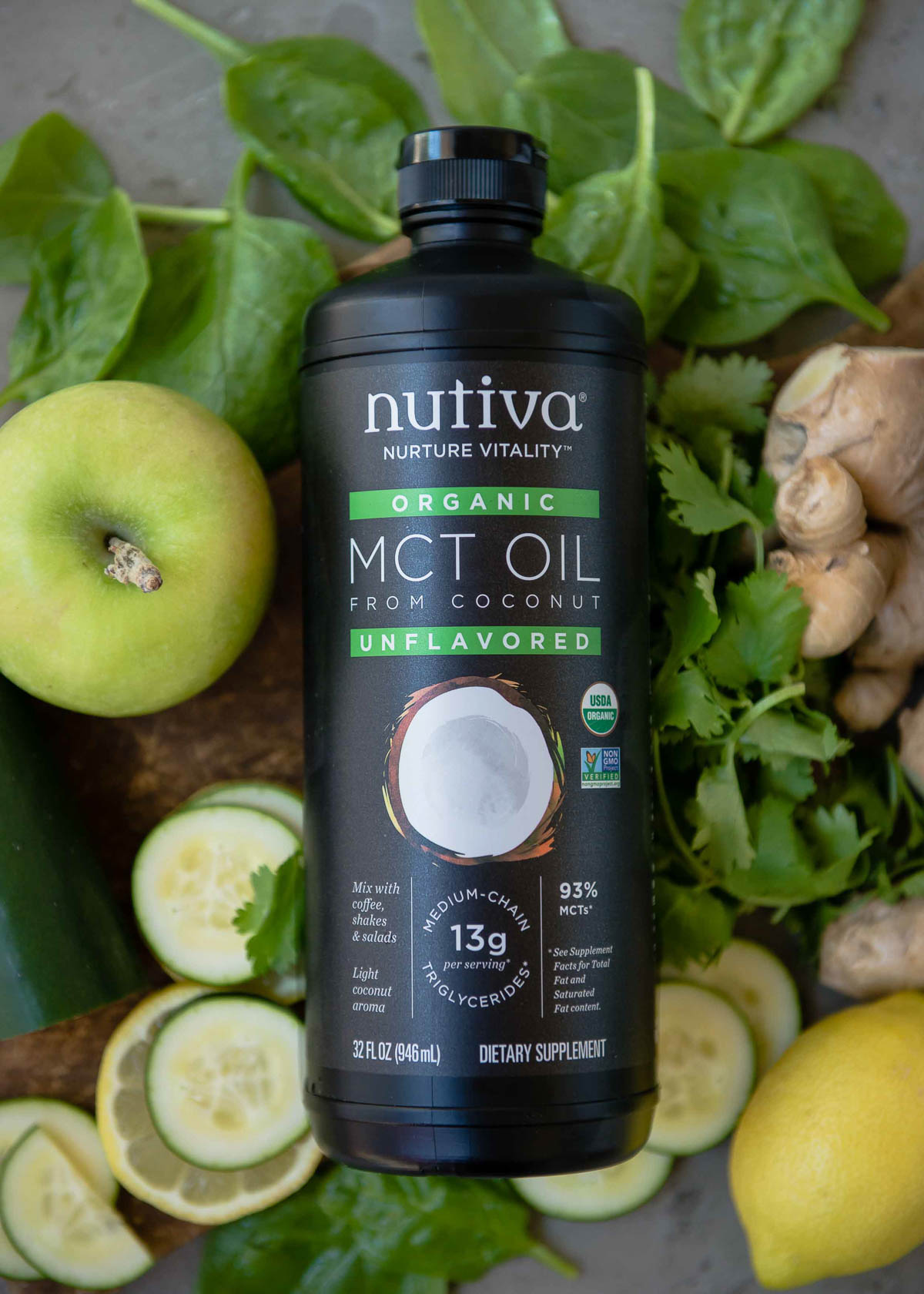 bottle of Nutiva MCT oil on a bed of smoothie ingredients.