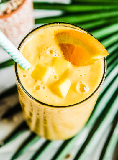 No banana smoothie in glass with straw