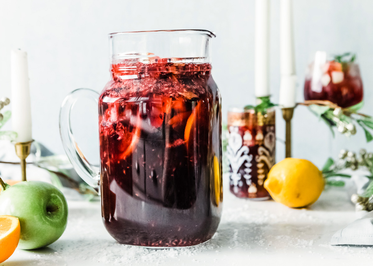 A glass jug filled with non-alcoholic sangria