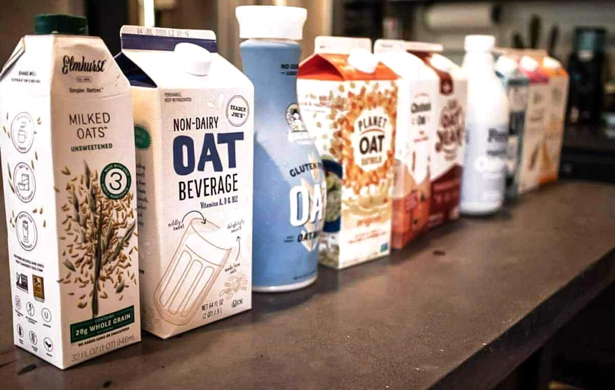 Array of oat milk brands side by side.