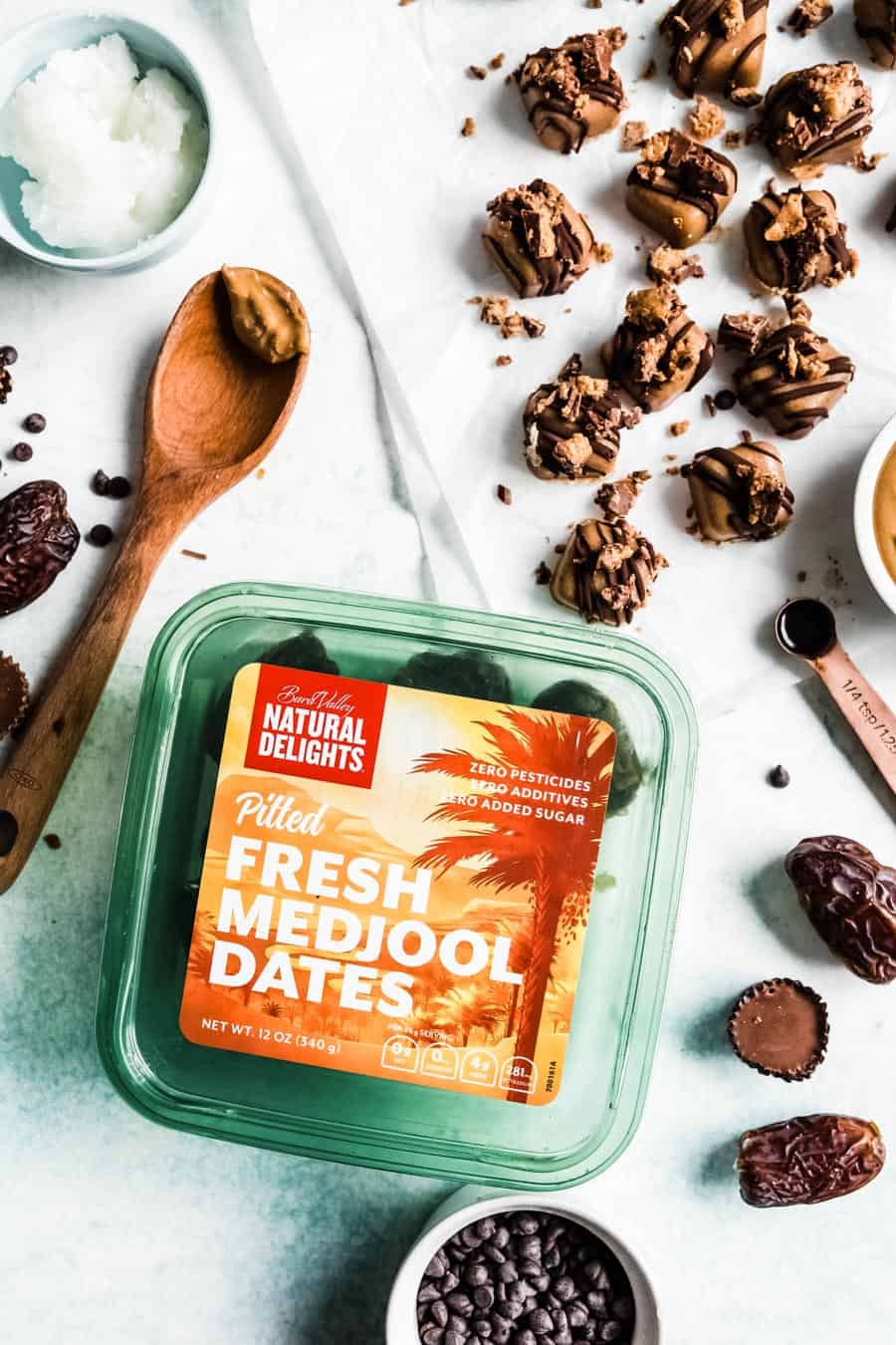 natural delights medjool dates box next to no bake dessert squares and other ingredients.