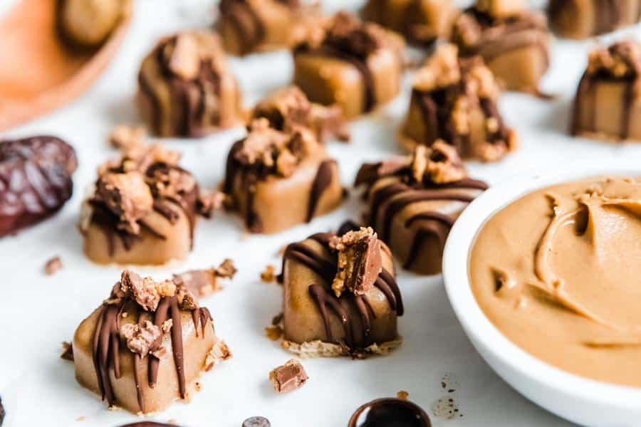 finished no bake fudge squares drizzled with chocolate and crushed peanut butter cups.