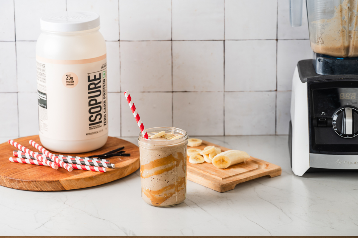 Peanut butter protein shake topped with sliced bananas