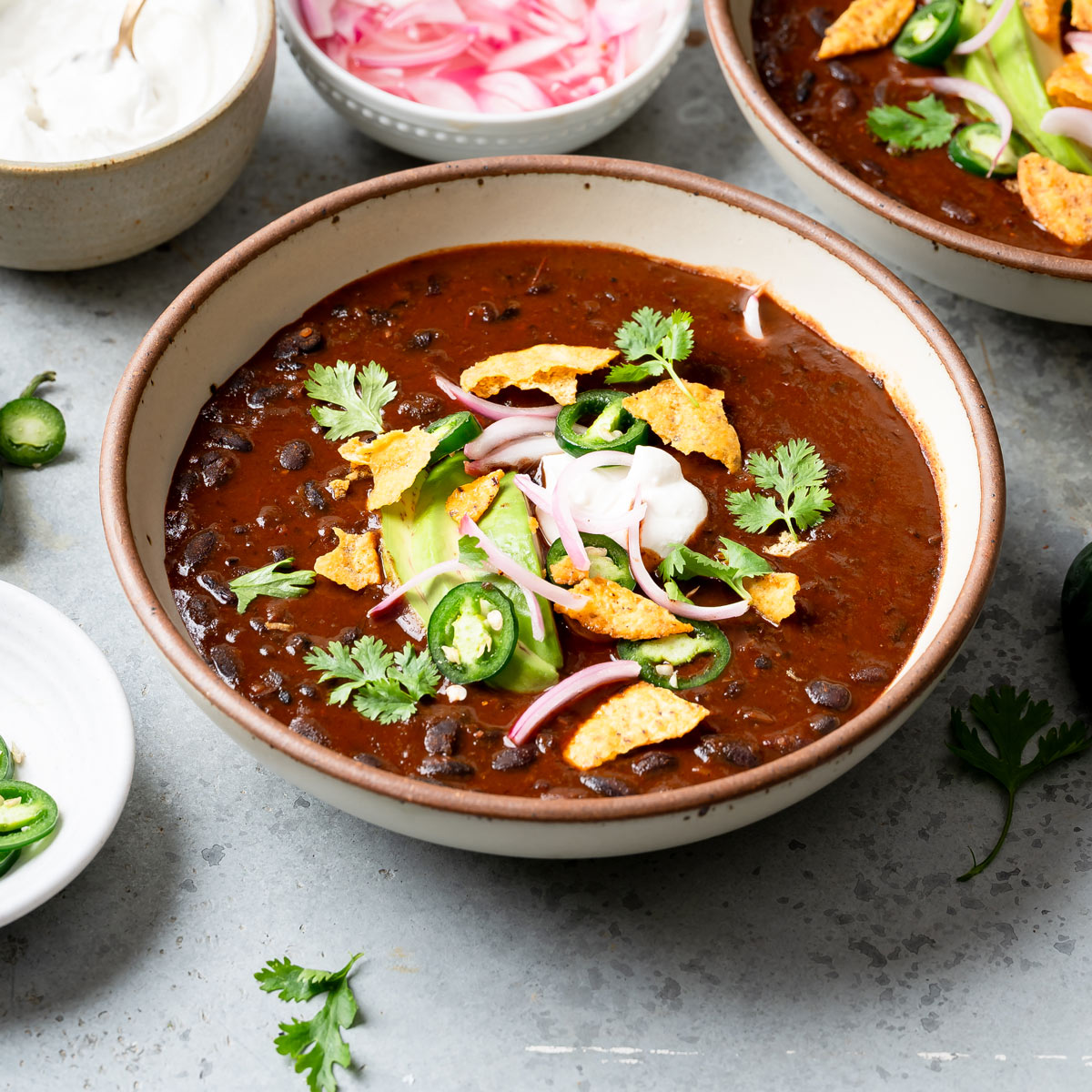 plant-based crockpot recipe in bowl with toppings