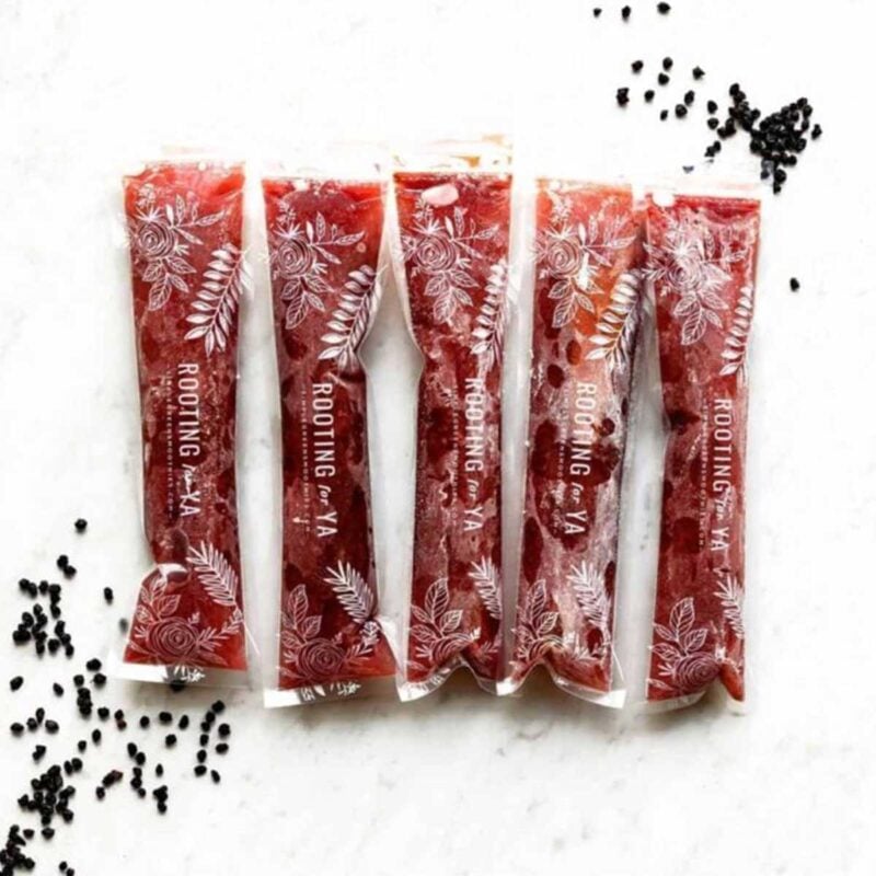 5 red-purple popsicles made with elderberry syrup for sore throat relief.