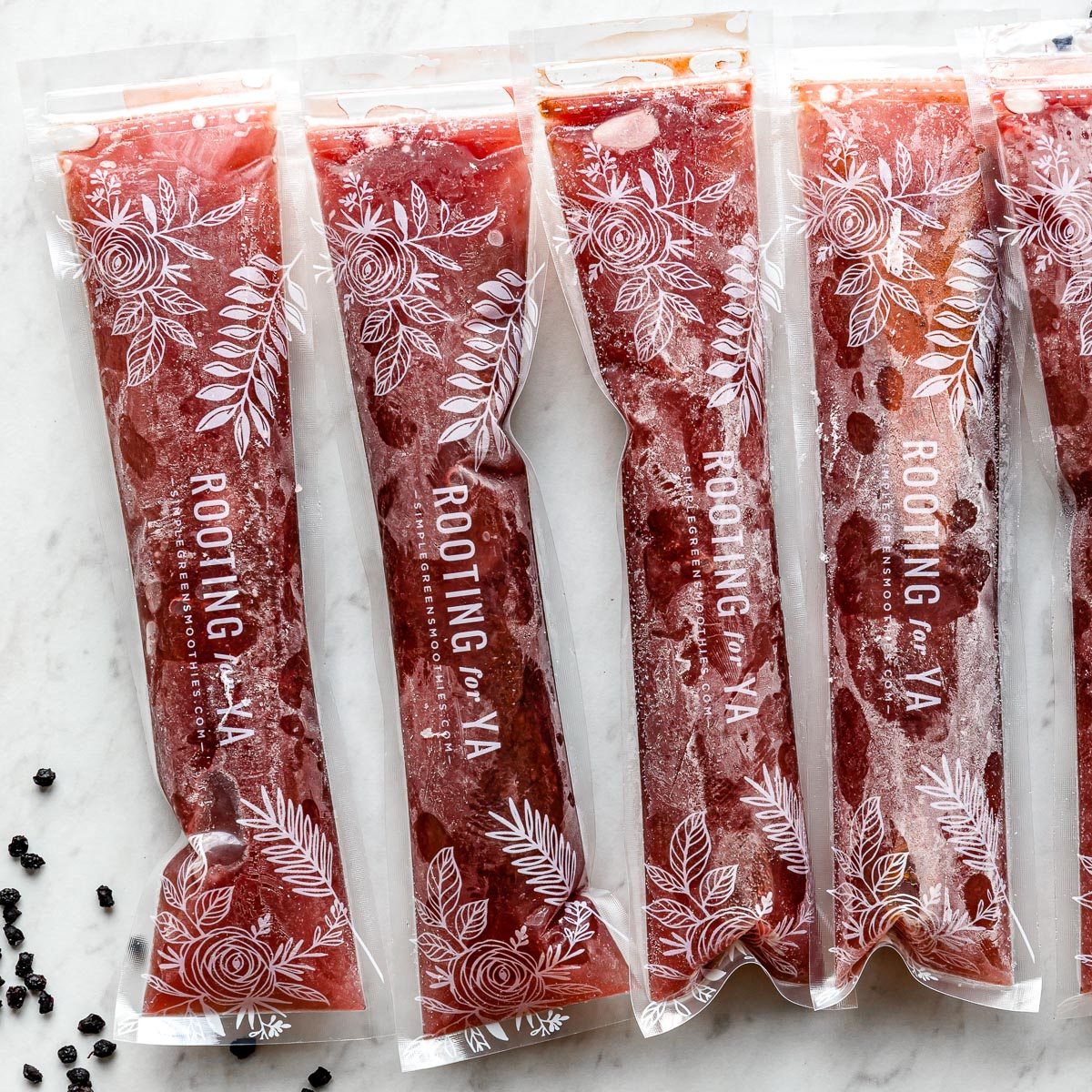 Plastic sleeves that say "Rooting for Ya" filled with elderberry popsicles.