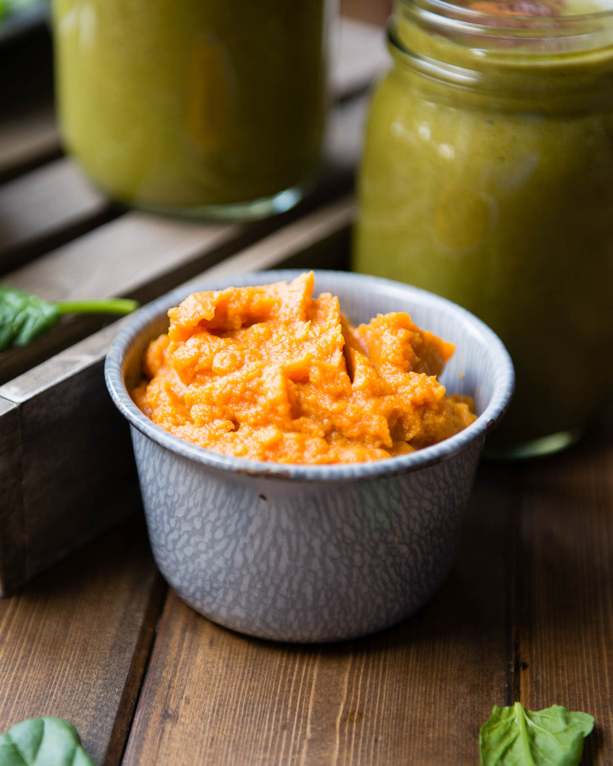 tin bowl full of pumpkin puree.