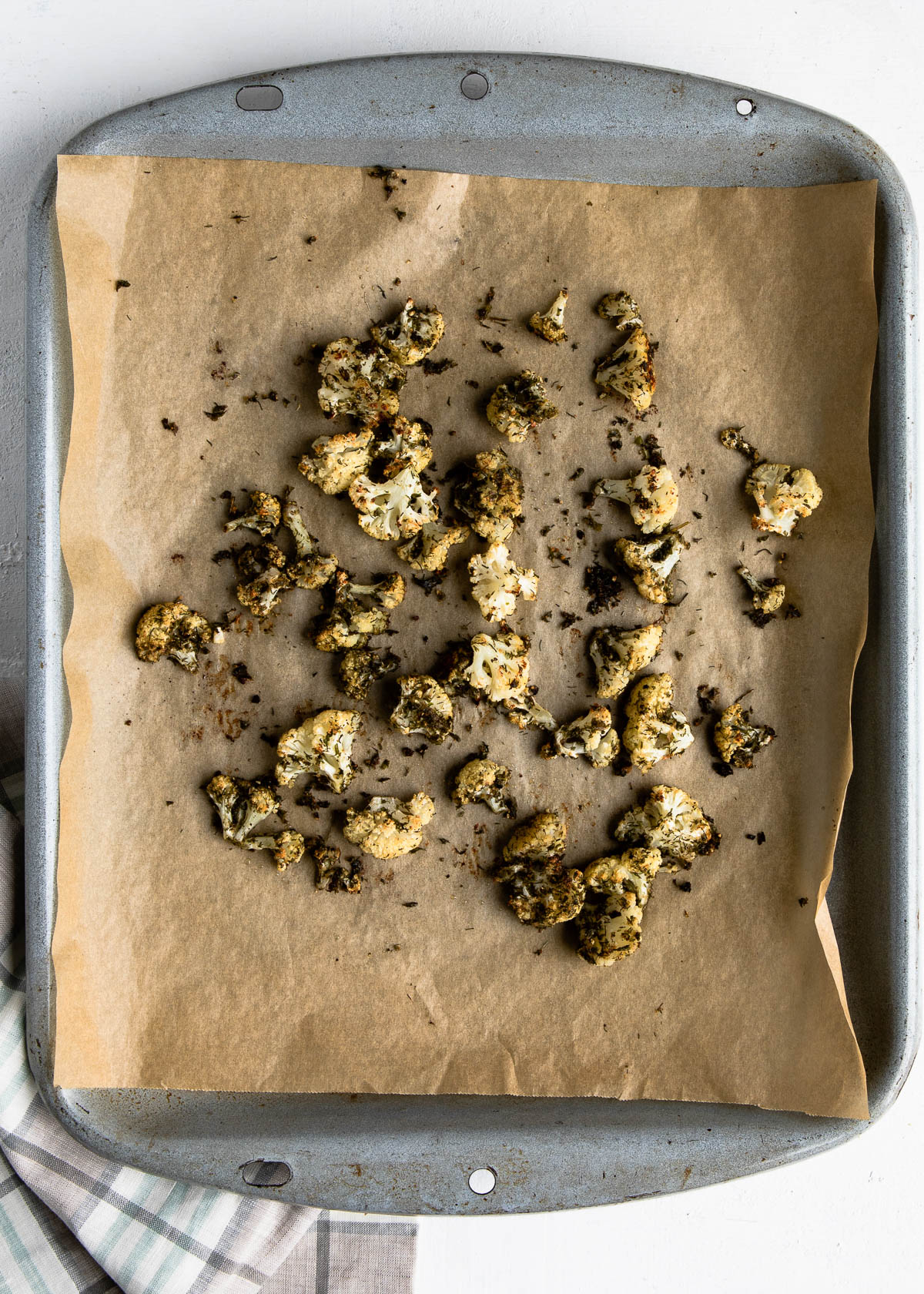 baked snack spread out on a parchment lined baking sheet.