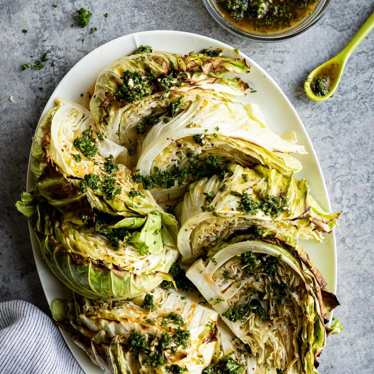 roasted cabbage wedges on a serving platter.