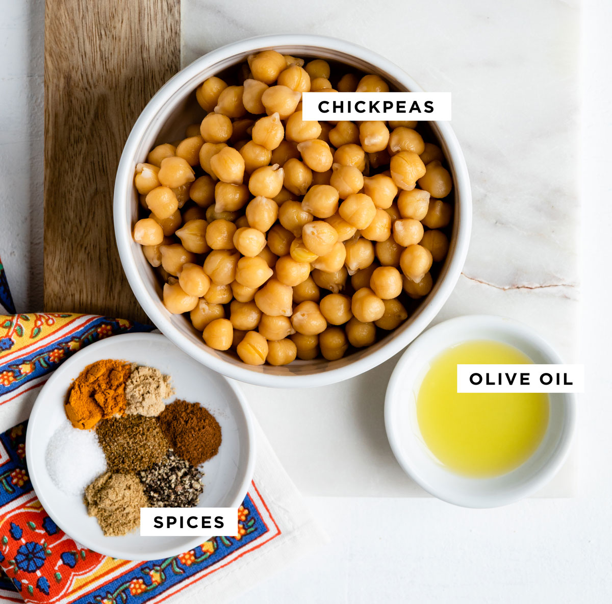 labeled ingredients for a snack including chickpeas, olive oil and spices.