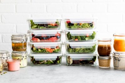 Stacked salads in glass containers