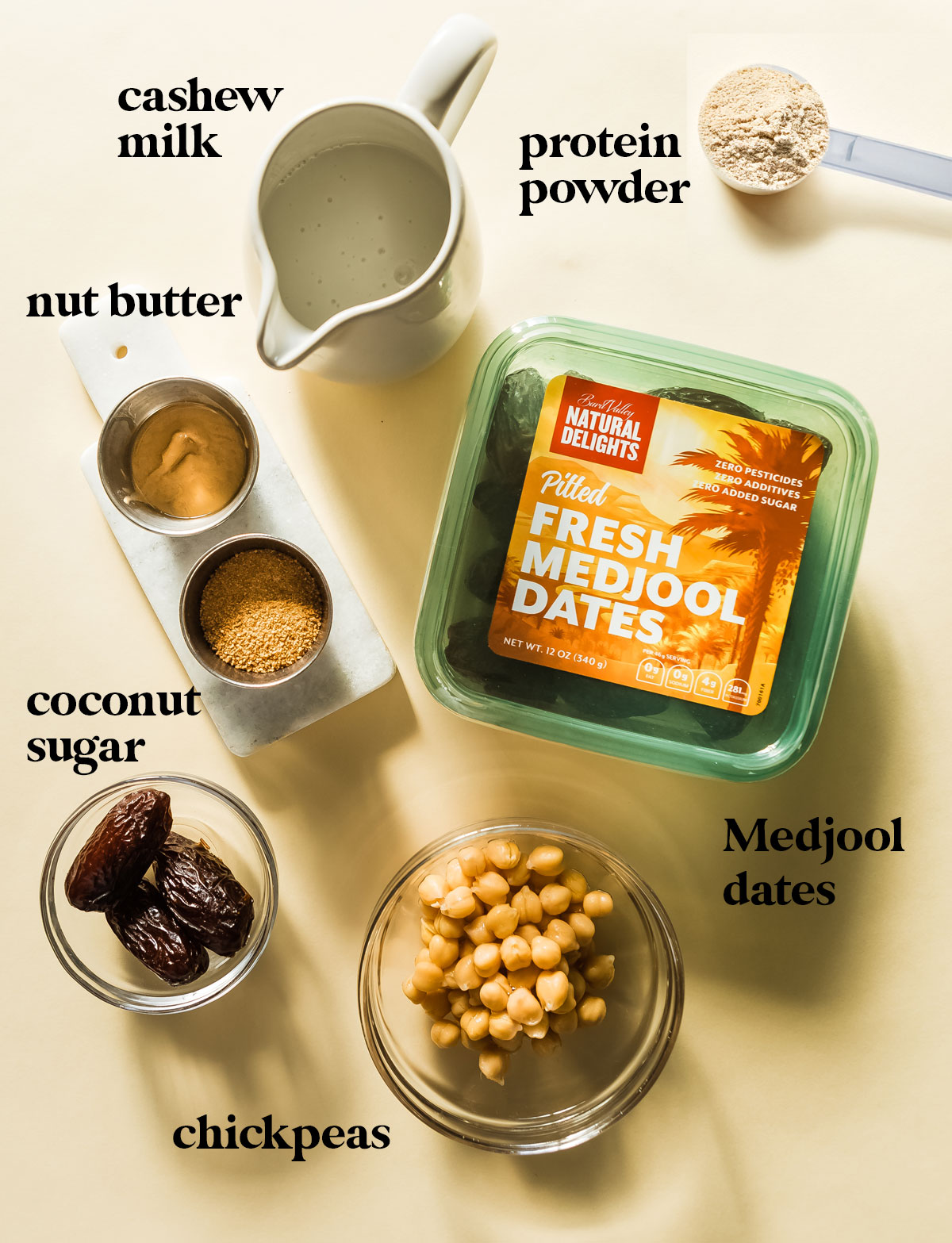 Ingredients for a salted caramel protein shake: chickpeas, medjool dates, cashew butter and coconut sugar.