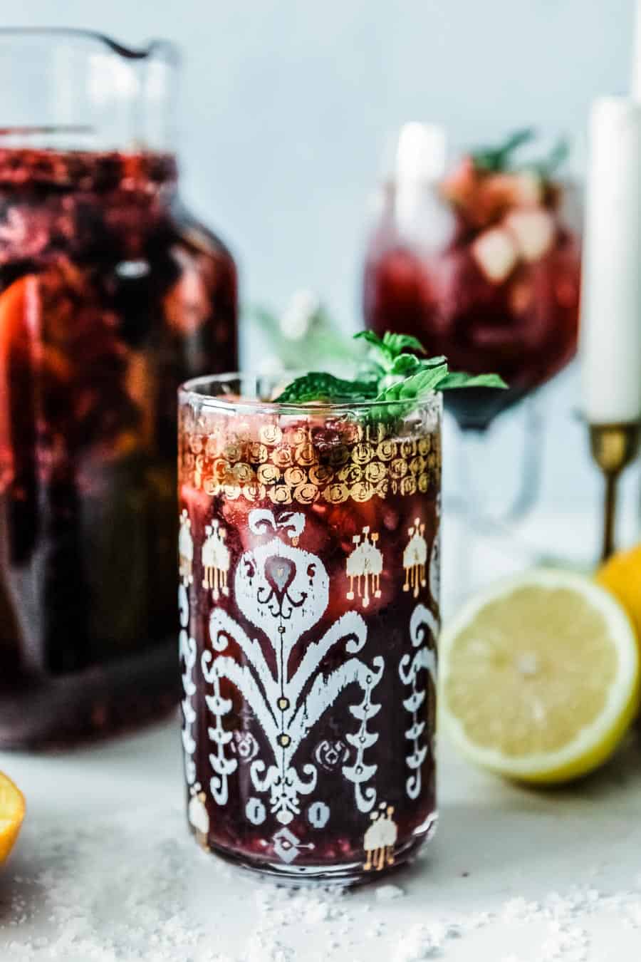 fun mocktail recipe in a festive glass topped with mint.