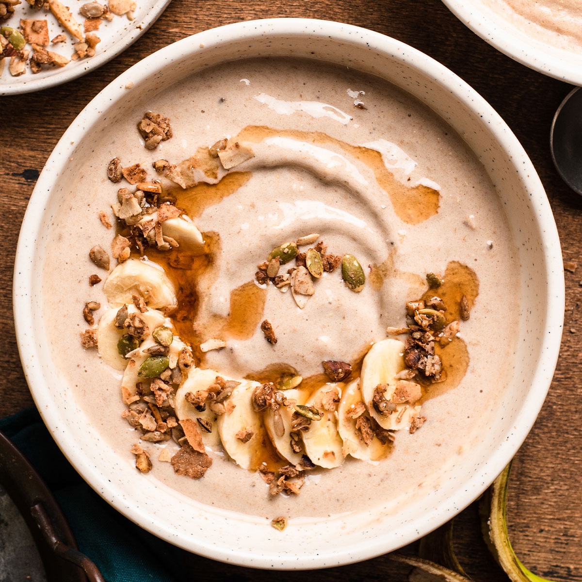 maple oat smoothie bowl with granola topping