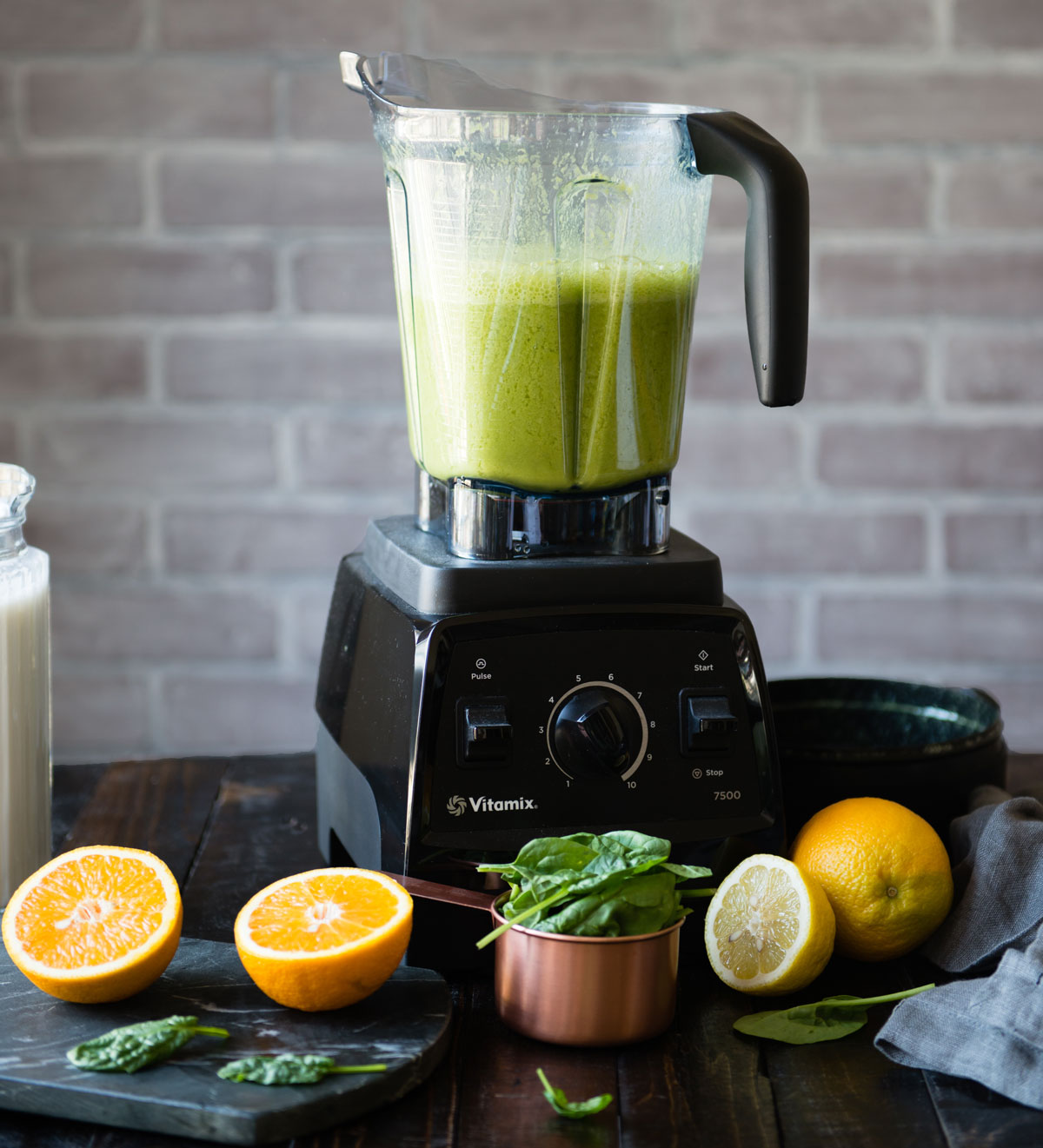 black Vitamix blender full of green smoothie for the smoothie diet plan.