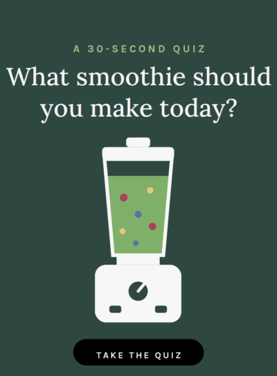 Smoothie blender with colorful ingredients for healthy smoothies.