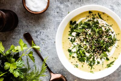 Bowl of celery soup on table for the challenge.