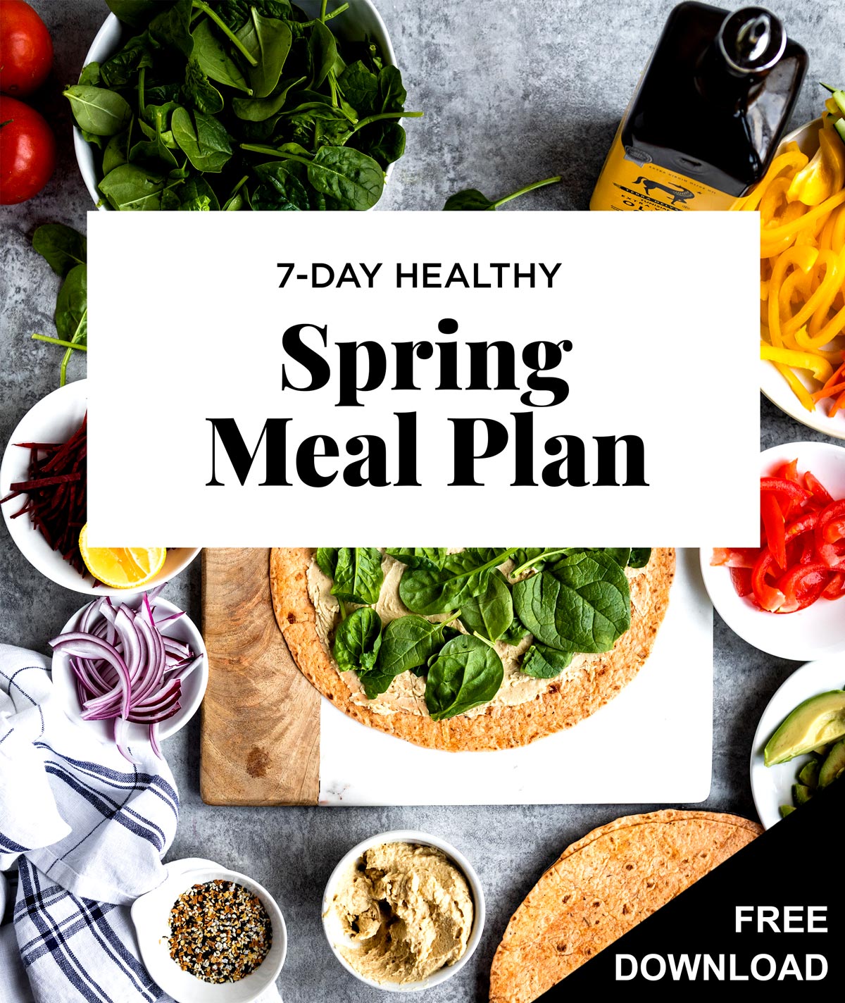 White box with black text saying 7-Day Healthy Spring Meals Plan overtop sliced vegetables and a wrap with hummus and spinach.