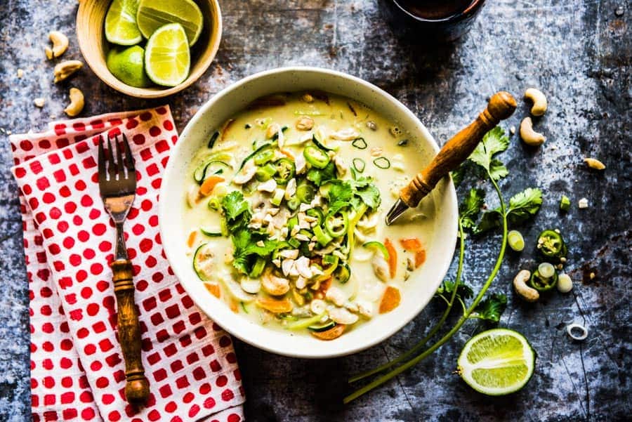 Thai coconut soup with lime and cashew for toppings