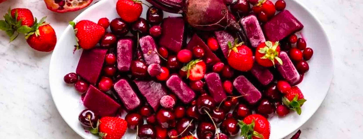 plate with dark red and purple ingredients: cherries, strawberries, beets, and more