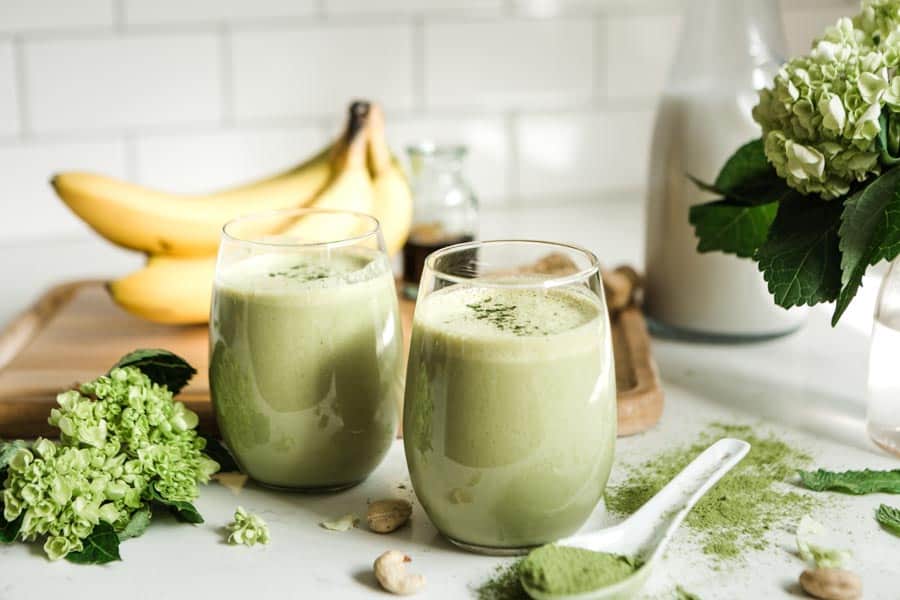 Two glasses of matcha smoothie ready to drink. 