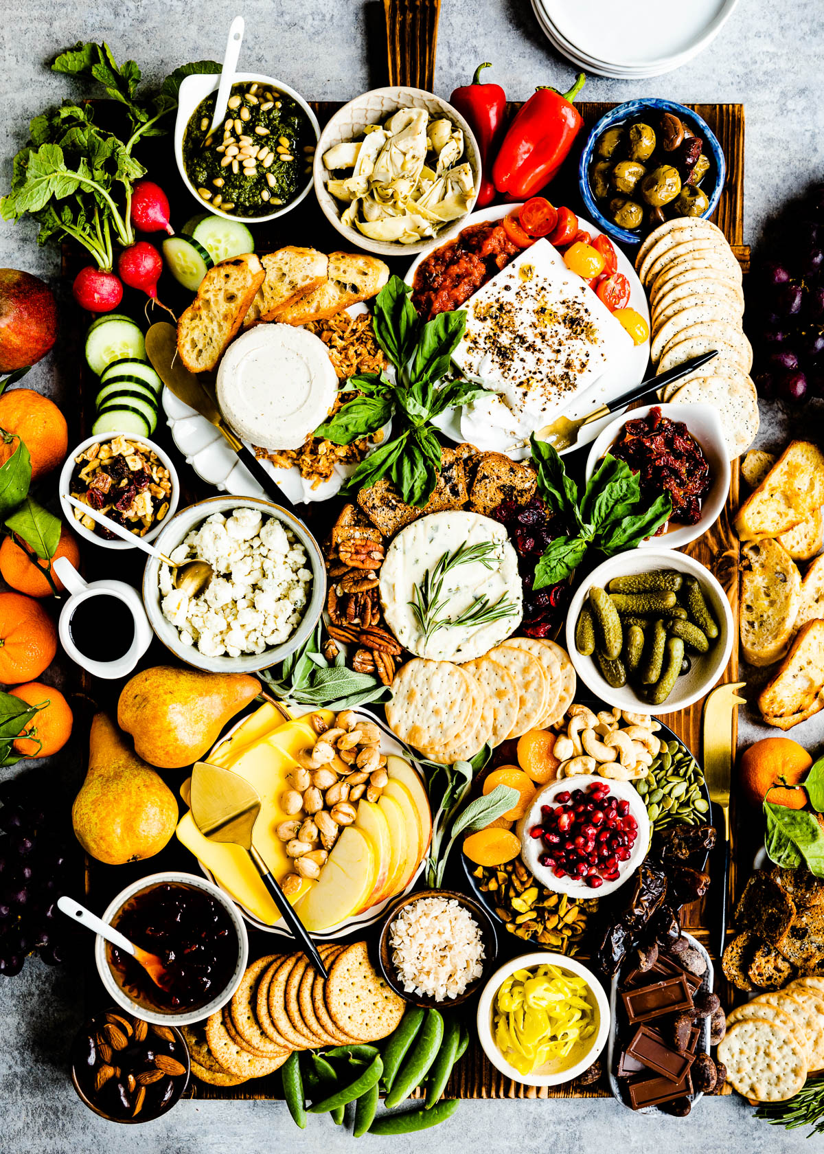 Charcuterie Board with various types of vegan cheese, Crackers, and veggies