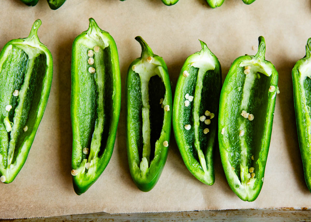 sliced jalapeños on parchment paper.