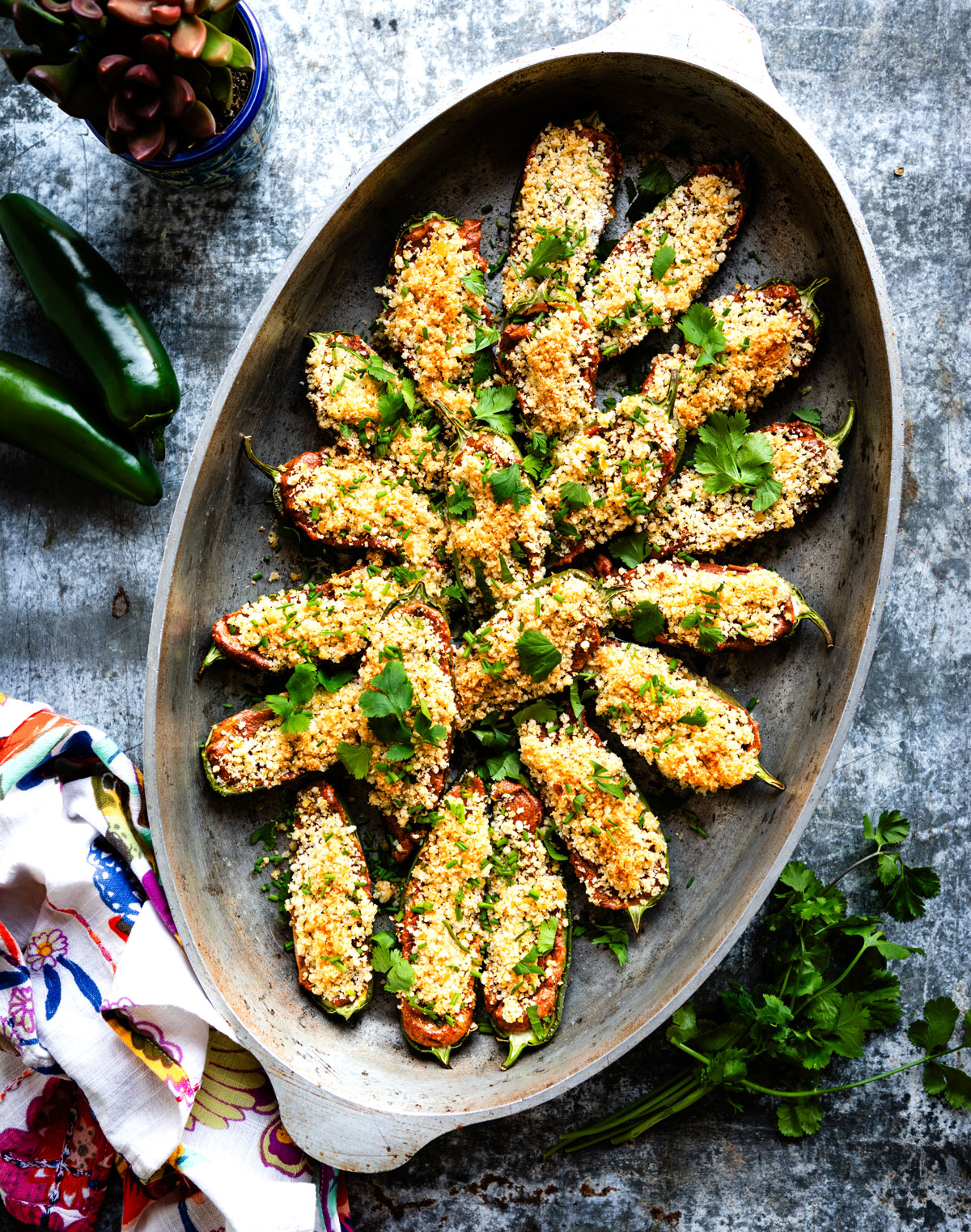 cast iron dish with vegan jalapeno poppers inside.