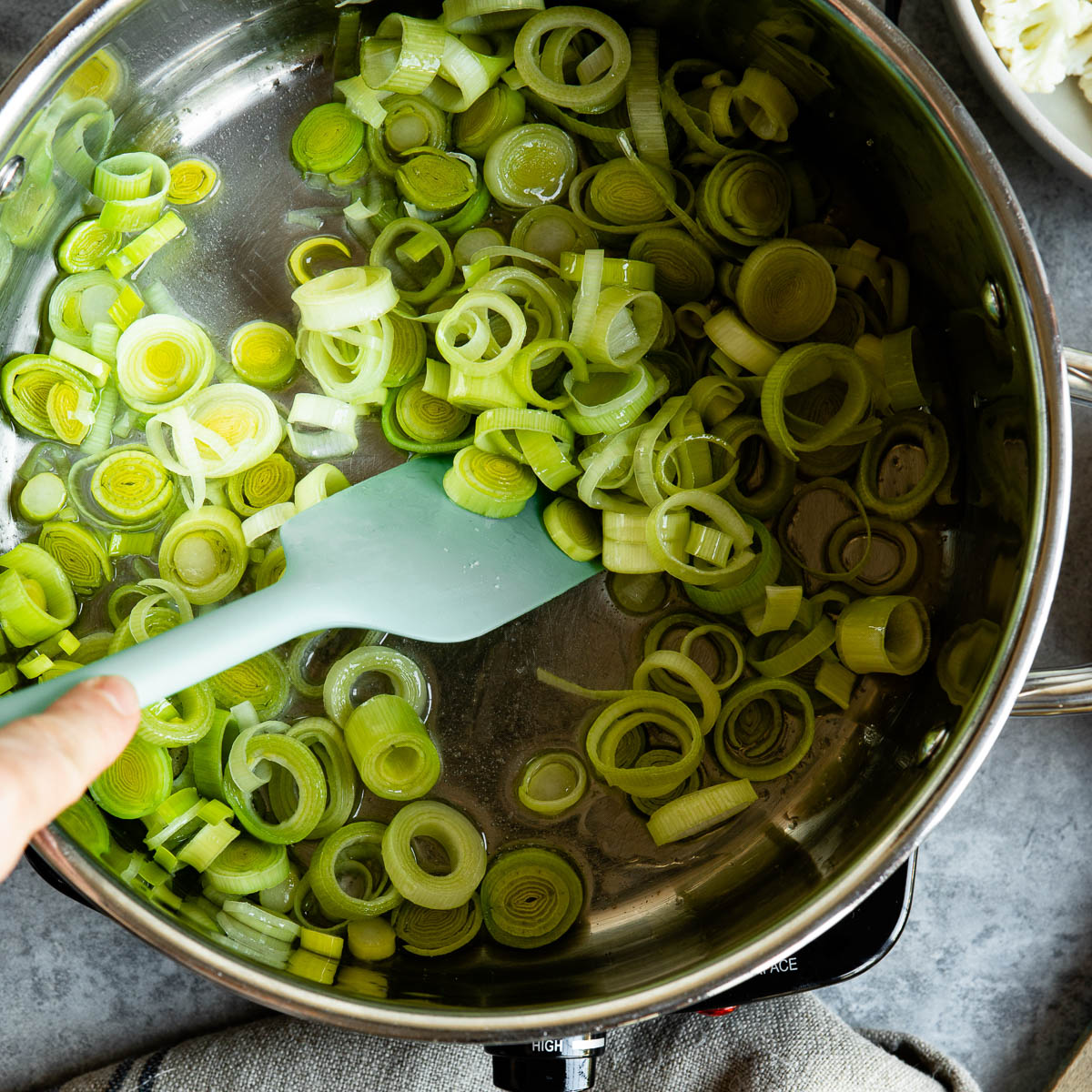 Chopped leek in a soup pot 